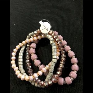 Bracelets in pretty green and lavender colors.